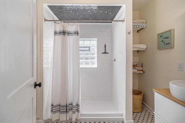 371 4th St, Pentwater, MI 49449 - bathroom featuring a stall shower and vanity