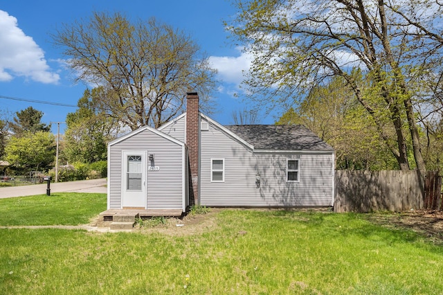 2335 Holmes Rd, Ypsilanti, MI 48198 - back of property featuring a chimney