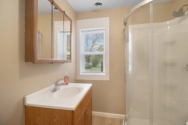 2335 Holmes Rd, Ypsilanti, MI 48198 - full bath with a shower stall, vanity, and baseboards