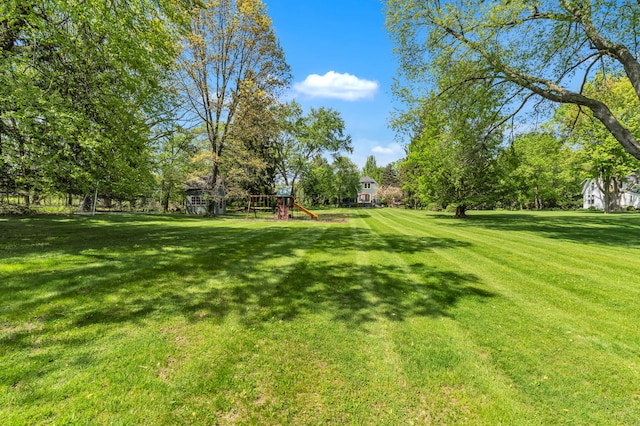 2462 N Dixboro Rd, Ann Arbor, MI 48105 - view of green lawn featuring a playground