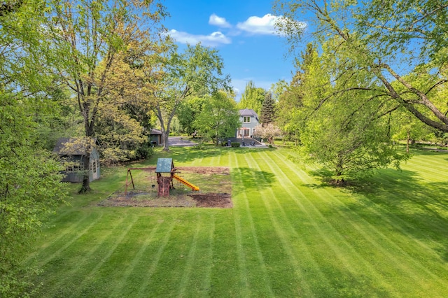 2462 N Dixboro Rd, Ann Arbor, MI 48105 - view of grassy yard with a playground