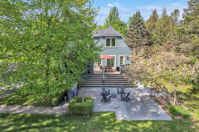 2462 N Dixboro Rd, Ann Arbor, MI 48105 - back of house featuring a wooden deck and a patio