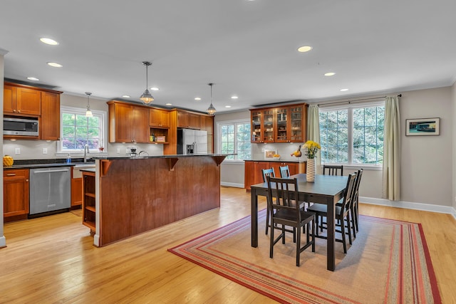 2462 N Dixboro Rd, Ann Arbor, MI 48105 - dining room with recessed lighting, light wood finished floors, ornamental molding, and baseboards