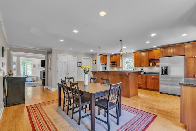 2462 N Dixboro Rd, Ann Arbor, MI 48105 - dining area featuring healthy amount of natural light, recessed lighting, light wood-type flooring, ornamental molding, and baseboards