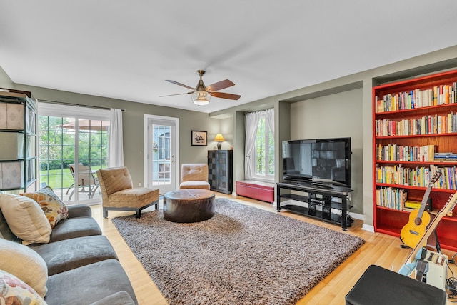 2462 N Dixboro Rd, Ann Arbor, MI 48105 - living area featuring a ceiling fan and wood finished floors