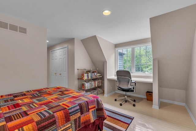 2462 N Dixboro Rd, Ann Arbor, MI 48105 - bedroom featuring wood finished floors, recessed lighting, baseboards, an office area, and a closet
