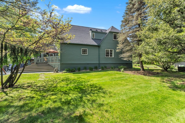 2462 N Dixboro Rd, Ann Arbor, MI 48105 - rear view of property featuring stairs, a deck, a yard, and a shingled roof
