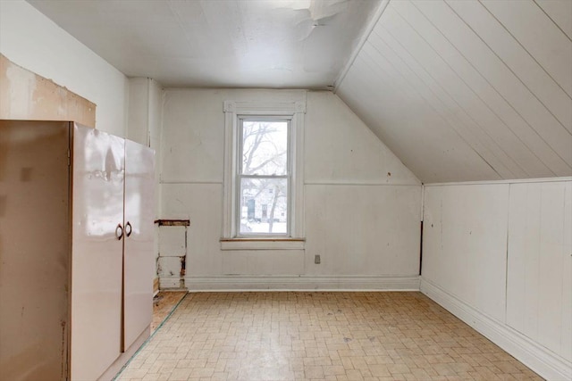additional living space featuring vaulted ceiling