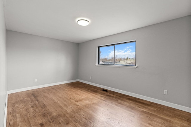 29244 Marshall St, Southfield, MI 48076 - empty room with wood finished floors and baseboards
