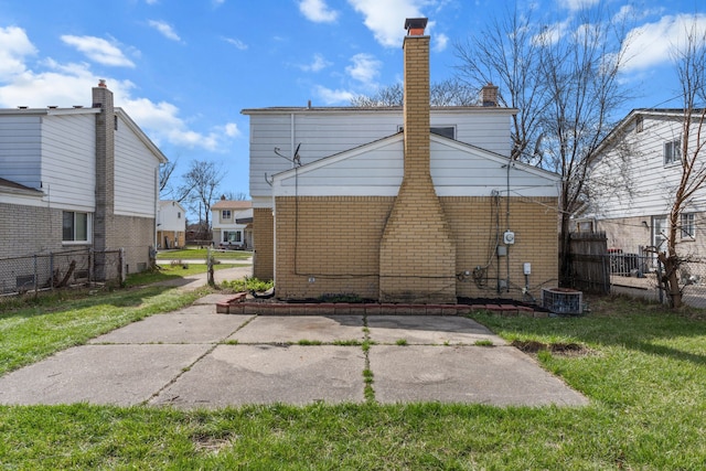 29244 Marshall St, Southfield, MI 48076 - back of property with brick siding and a chimney