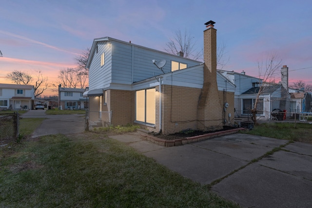 29244 Marshall St, Southfield, MI 48076 - back of house featuring brick siding and a chimney