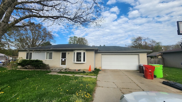 38120 Winkler St, Harrison Township, MI 48045 - ranch-style home with brick siding, concrete driveway, and an attached garage