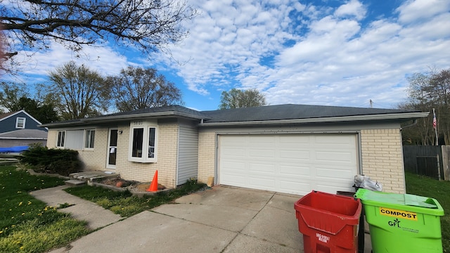 38120 Winkler St, Harrison Township, MI 48045 - ranch-style home with brick siding, concrete driveway, an attached garage, and fence