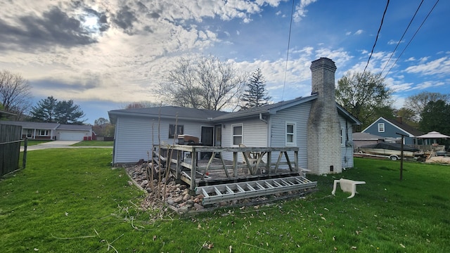 38120 Winkler St, Harrison Township, MI 48045 - rear view of property with a chimney, a lawn, and a deck