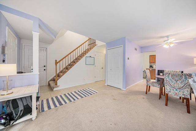 3049 Turnberry Ln, Ann Arbor, MI 48108 - living area with stairway, carpet, a ceiling fan, baseboards, and decorative columns