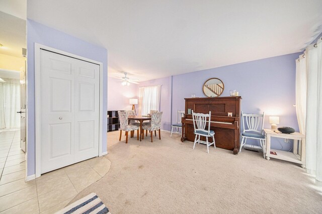 3049 Turnberry Ln, Ann Arbor, MI 48108 - living area featuring ceiling fan, tile patterned floors, carpet flooring, and baseboards