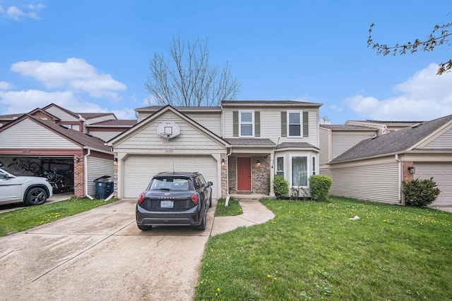 3049 Turnberry Ln, Ann Arbor, MI 48108 - traditional-style house featuring driveway, an attached garage, and a front yard