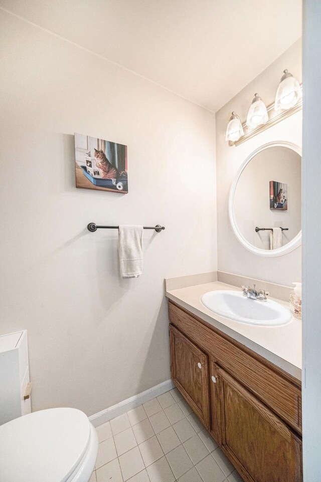 3049 Turnberry Ln, Ann Arbor, MI 48108 - bathroom featuring vanity, toilet, tile patterned flooring, and baseboards