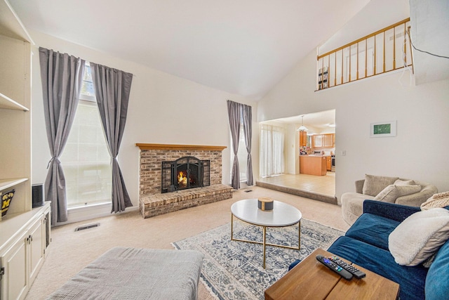 3049 Turnberry Ln, Ann Arbor, MI 48108 - living room with light carpet, a fireplace, and high vaulted ceiling