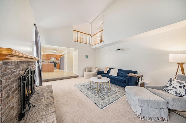3049 Turnberry Ln, Ann Arbor, MI 48108 - living area with light carpet, high vaulted ceiling, and a fireplace