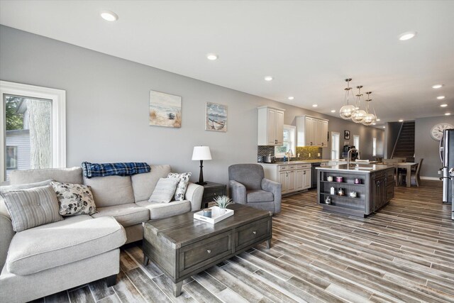 292 Lyon Lake Rd, Marshall, MI 49068 - living area featuring light wood-style flooring, recessed lighting, baseboards, and a chandelier