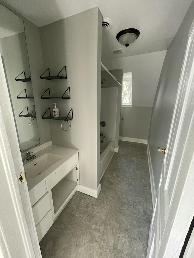811 Park St SW, Grand Rapids, MI 49504 - bathroom featuring shower / bathtub combination, vanity, and baseboards