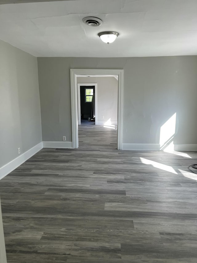 811 Park St SW, Grand Rapids, MI 49504 - unfurnished room featuring baseboards and dark wood finished floors