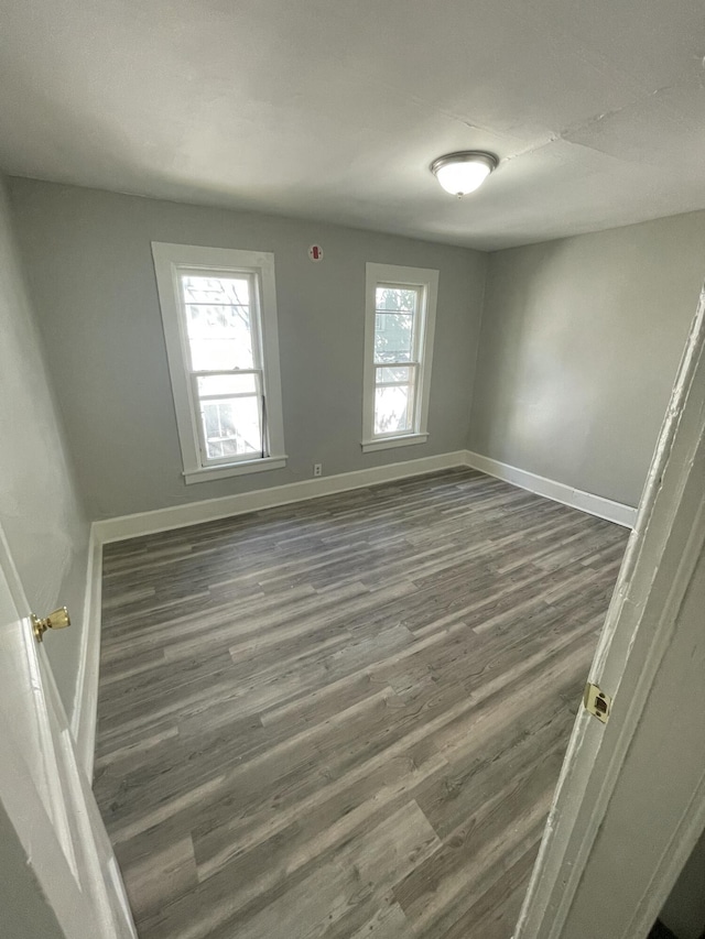 811 Park St SW, Grand Rapids, MI 49504 - spare room with wood finished floors and baseboards