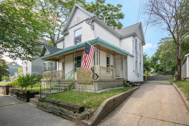 811 Park St SW, Grand Rapids, MI 49504 - victorian-style house featuring covered porch and roof with shingles