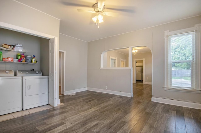 811 Park St SW, Grand Rapids, MI 49504 - unfurnished living room with a ceiling fan, washer and dryer, wood finished floors, and plenty of natural light