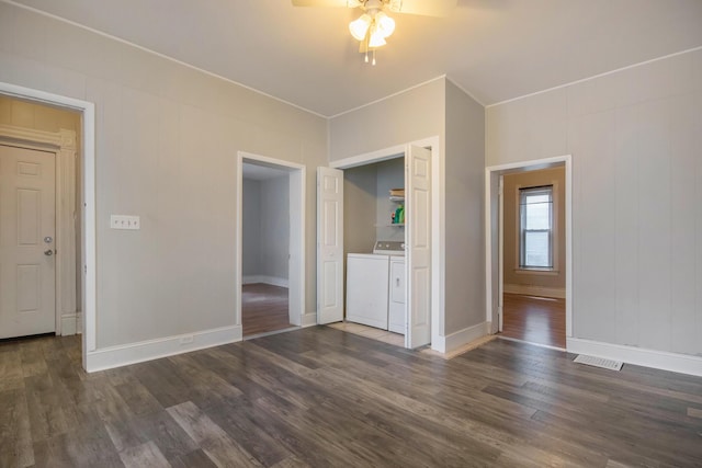 811 Park St SW, Grand Rapids, MI 49504 - empty room with ceiling fan, dark wood-style flooring, washing machine and dryer, and baseboards