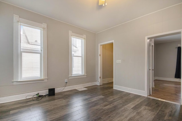 811 Park St SW, Grand Rapids, MI 49504 - unfurnished room with dark wood-style flooring and baseboards