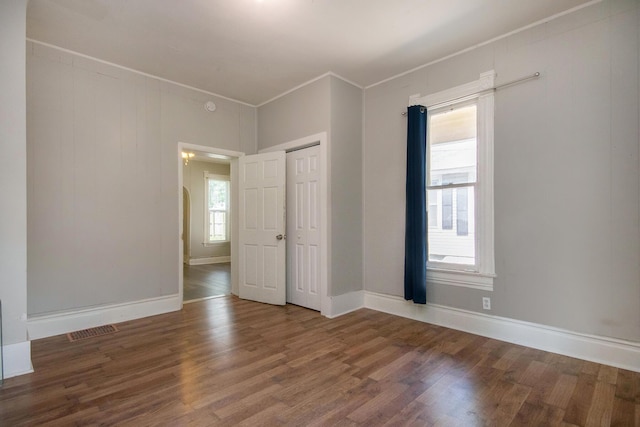 811 Park St SW, Grand Rapids, MI 49504 - unfurnished room with wood finished floors, crown molding, and baseboards