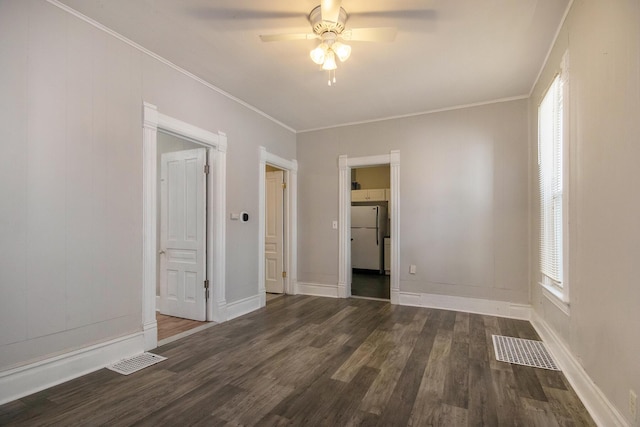 811 Park St SW, Grand Rapids, MI 49504 - empty room featuring a ceiling fan, wood finished floors, baseboards, and crown molding