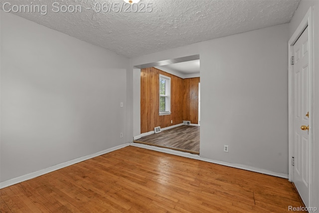 15285 Hazelridge St, Detroit, MI 48205 - spare room featuring wood finished floors, baseboards, and a textured ceiling