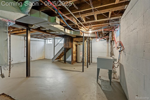 15285 Hazelridge St, Detroit, MI 48205 - below grade area featuring gas water heater, stairway, and a sink