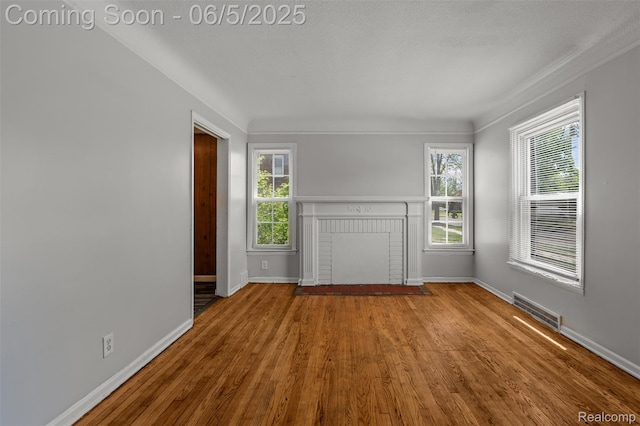 15285 Hazelridge St, Detroit, MI 48205 - unfurnished living room featuring wood finished floors, baseboards, and crown molding