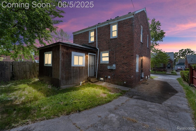 15285 Hazelridge St, Detroit, MI 48205 - view of home's exterior featuring entry steps, brick siding, and asphalt driveway