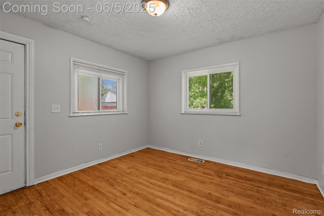 15285 Hazelridge St, Detroit, MI 48205 - unfurnished room featuring light wood finished floors, baseboards, and a textured ceiling