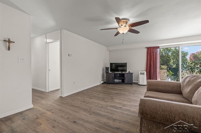 2119 Bayliss St, Midland, MI 48640 - living area with ceiling fan, wood finished floors, baseboard heating, baseboards, and a baseboard radiator