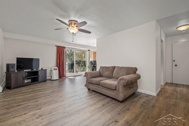 2119 Bayliss St, Midland, MI 48640 - living room with ceiling fan, wood finished floors, a baseboard radiator, and baseboards