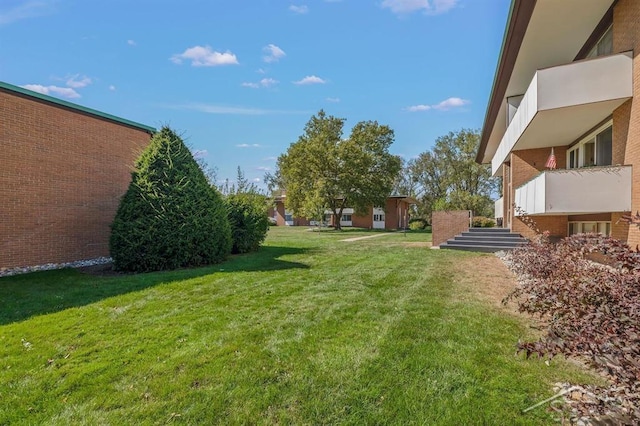 2119 Bayliss St, Midland, MI 48640 - view of grassy yard with stairway