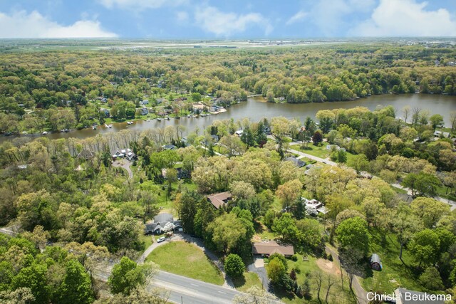 7044 Cascade Rd SE, Grand Rapids, MI 49546 - aerial view of property's location featuring a nearby body of water and a heavily wooded area