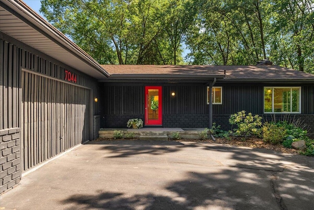 7044 Cascade Rd SE, Grand Rapids, MI 49546 - doorway to property with brick siding
