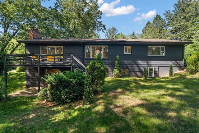 7044 Cascade Rd SE, Grand Rapids, MI 49546 - back of property with stairs, a chimney, a wooden deck, and a yard