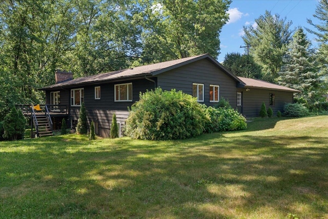 7044 Cascade Rd SE, Grand Rapids, MI 49546 - rear view of property featuring stairway, a chimney, a wooden deck, and a yard