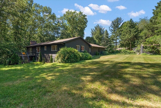 7044 Cascade Rd SE, Grand Rapids, MI 49546 - view of green lawn featuring stairs and a deck