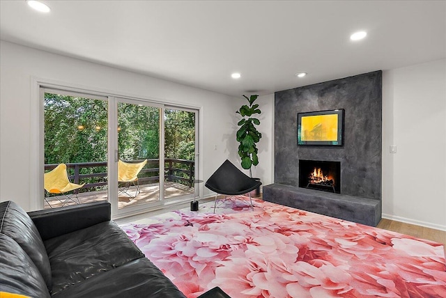 7044 Cascade Rd SE, Grand Rapids, MI 49546 - bedroom with access to exterior, recessed lighting, a large fireplace, and wood finished floors