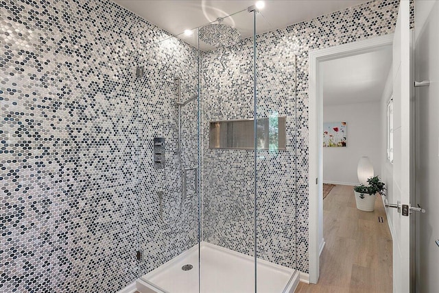 7044 Cascade Rd SE, Grand Rapids, MI 49546 - full bath featuring a stall shower and wood finished floors