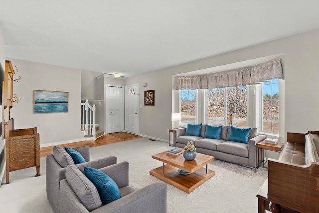 9009 N Pheasant Ridge Ln, Saline, MI 48176 - living area with baseboards, carpet, and stairway